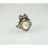 A 19th century moonstone and rose cut diamond heart and bow ring