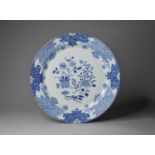 A Chinese blue and white dish, 18th centuryOf plain round form and decorated with a vase with