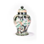 A Chinese famille noir jar and cover, KangxiOf baluster form, the domed cover with cone finial,