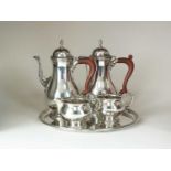 A George III style four piece silver coffee service and tray