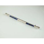 An Art Deco diamond and sapphire bar brooch