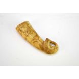 A Chinese mottled 'chicken bone' jade rhyton cup