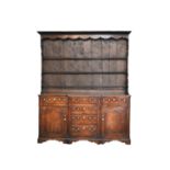 A late 18th century fruitwood or yew wood breakfront dresser, North Wales