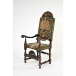 A 17th century carved oak upholstered open armchair, probably Flemish