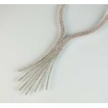 A diamond set stylised tassel fringe necklace