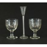A pair of 19th century engraved glass goblets and an air-twist glass