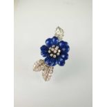 A blue enamel and diamond flower brooch by Boucheron