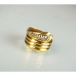 An 18ct gold diamond set snake ring