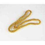 A yellow metal multi-strand rope twist chain necklace