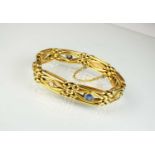 A sapphire and diamond stylised gate link bracelet