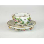 A Meissen relief-moulded cabinet cup and saucer