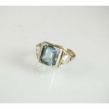 An Art Deco three stone aquamarine and diamond ring