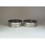 A pair of late Victorian silver mounted Magnum wine coasters