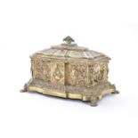 A late 19th century Continental relief moulded brass casket