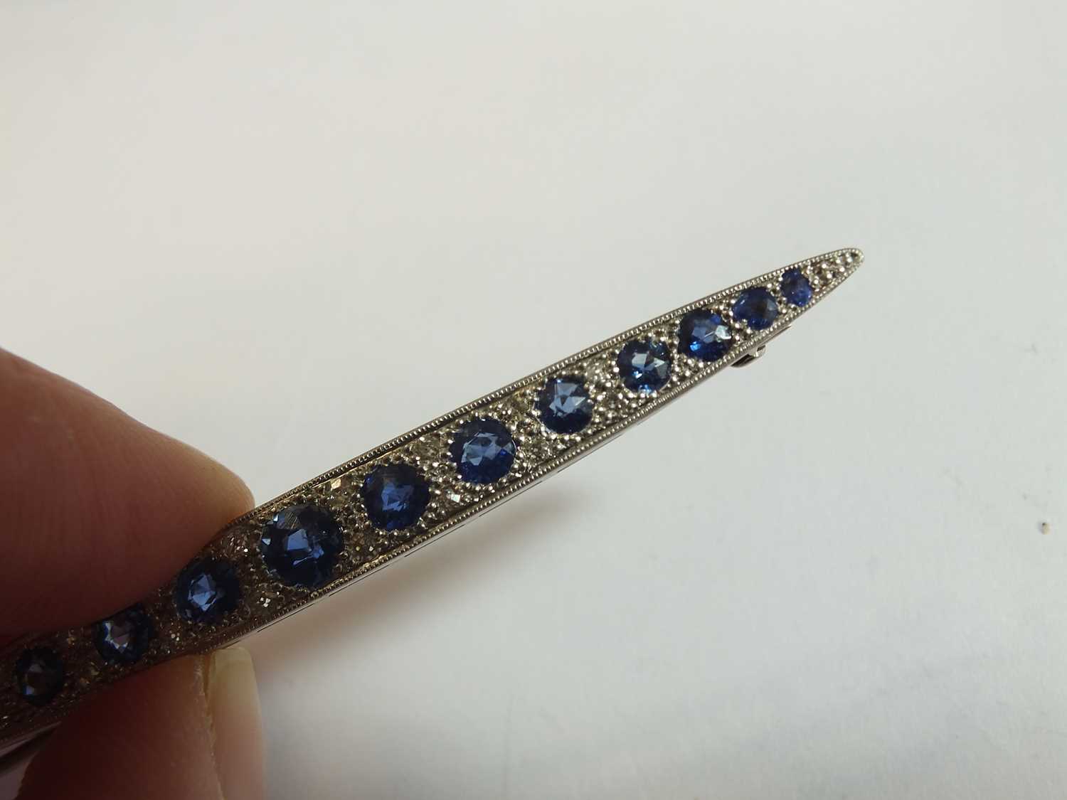 A Victorian style graduated sapphire and diamond line brooch - Image 4 of 8