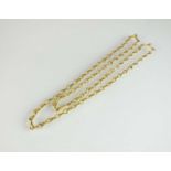 A textured yellow metal chain necklace