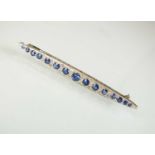 A Victorian style graduated sapphire and diamond line brooch
