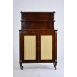 An early 19th century rosewood veneered bookcase