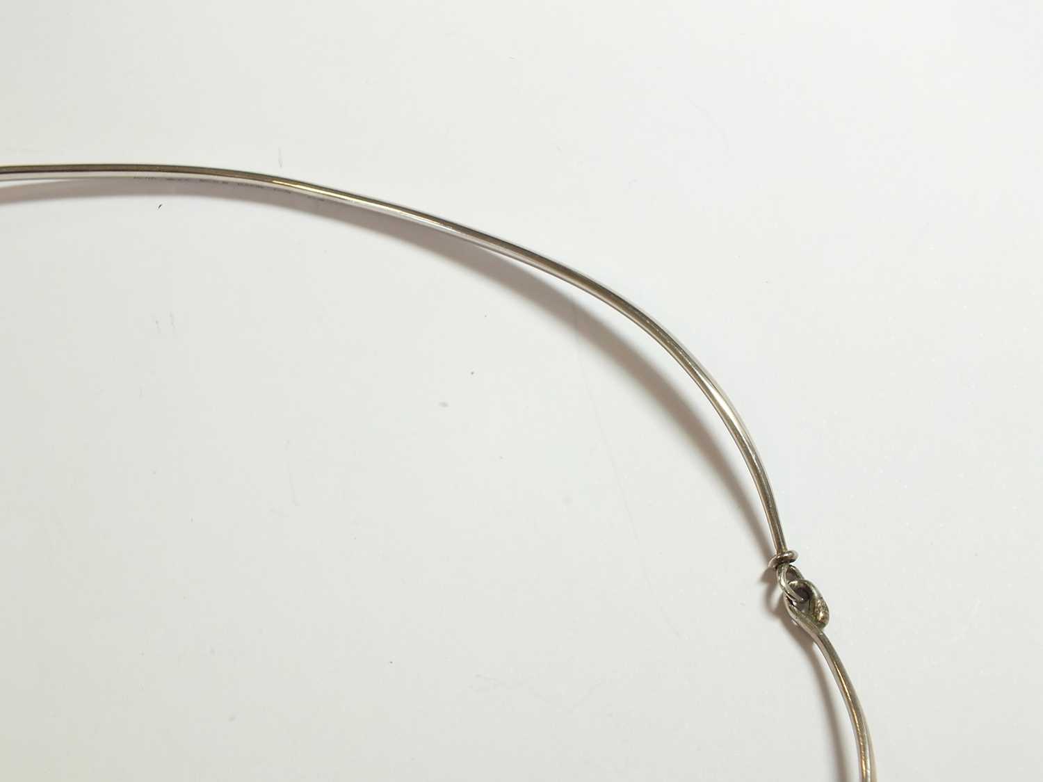 A Georg Jensen silver neck ring and rutilated quartz pendant designed by Vivianna Torun Bulow-Hube - Image 9 of 11