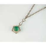 An Art Deco emerald and diamond pendant on chain