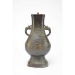 A Chinese bronze vase, Hu