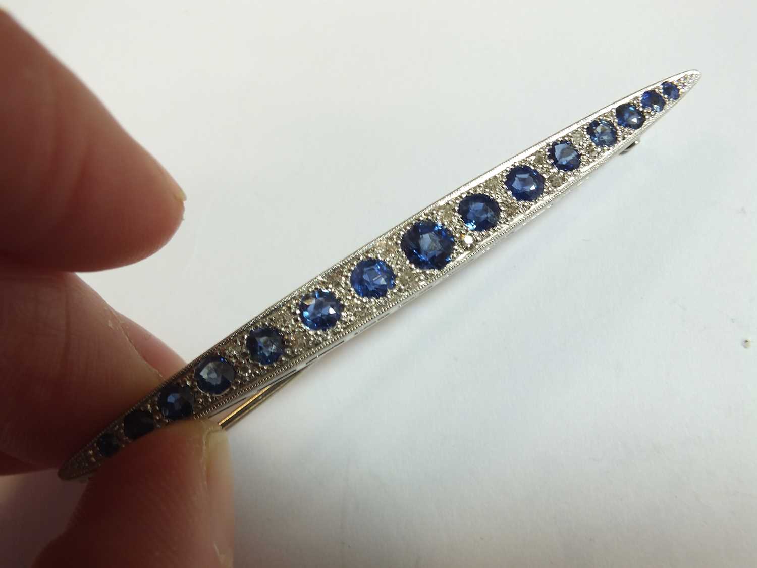A Victorian style graduated sapphire and diamond line brooch - Image 3 of 8