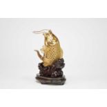 A Near Eastern jewelled gilt metal figure of a carp