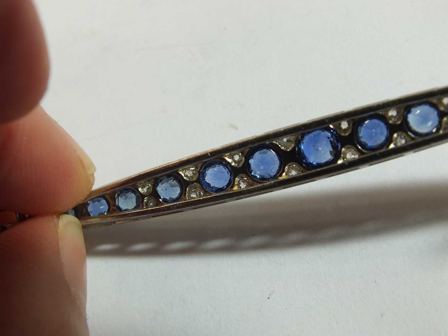 A Victorian style graduated sapphire and diamond line brooch - Image 7 of 8