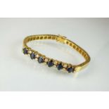 A sapphire and diamond line bracelet