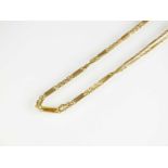 A two strand yellow metal chain necklace