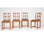 A set of four oak Arts and Crafts style trellis-back standard chairs