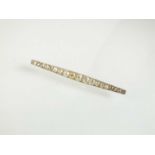 A graduated old cut diamond bar brooch