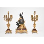 A late 19th/early 20th century, French, Rococo style, ormolu and marble mantel clock garniture