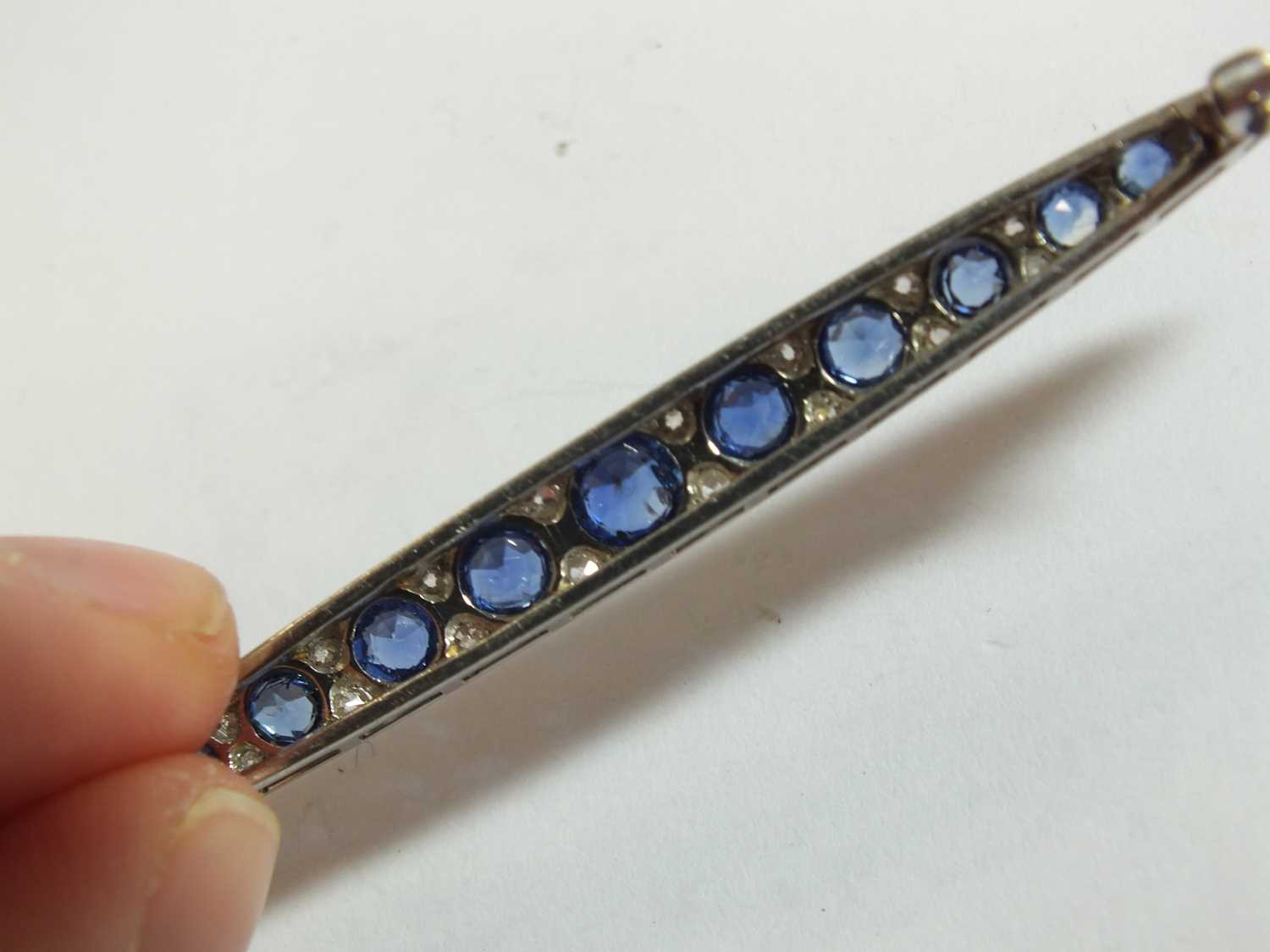 A Victorian style graduated sapphire and diamond line brooch - Image 6 of 8