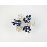 A diamond and sapphire stylised leaf cluster brooch