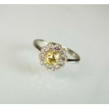 A yellow and white diamond floral cluster ring