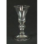 A heavy baluster wine glass, circa 1710