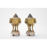 A pair of gilt metal and white veined marble urns and covers, circa 1900