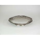 A silver pedestal shallow bowl