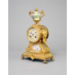 A late 19th century French, porcelain mounted, gilt metal mantel clock