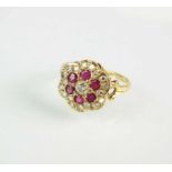 A ruby and diamond floral cluster ring