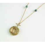 A turquoise and split pearl circular locket pendant