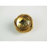 A reverse carved intaglio rock crystal brooch depicting a cat