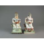 Two similar Staffordshire pearlware figures of reading maidens, early 19th century
