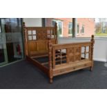 A Gillows late Victorian Gothic revival oak double bed, probably Bruce Talbert