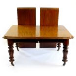 A Victorian mahogany wind-out dining table and five balloon back chairs