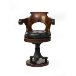 A mahogany and cast-iron revolving steamship chair