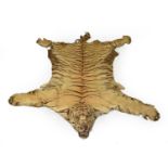 Taxidermy: a tiger skin rug with head, possibly Rowland Ward