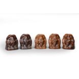 Five treacle-glazed pottery lion-head sash window stops