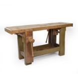 An early 20th century beech workbench with integral vices